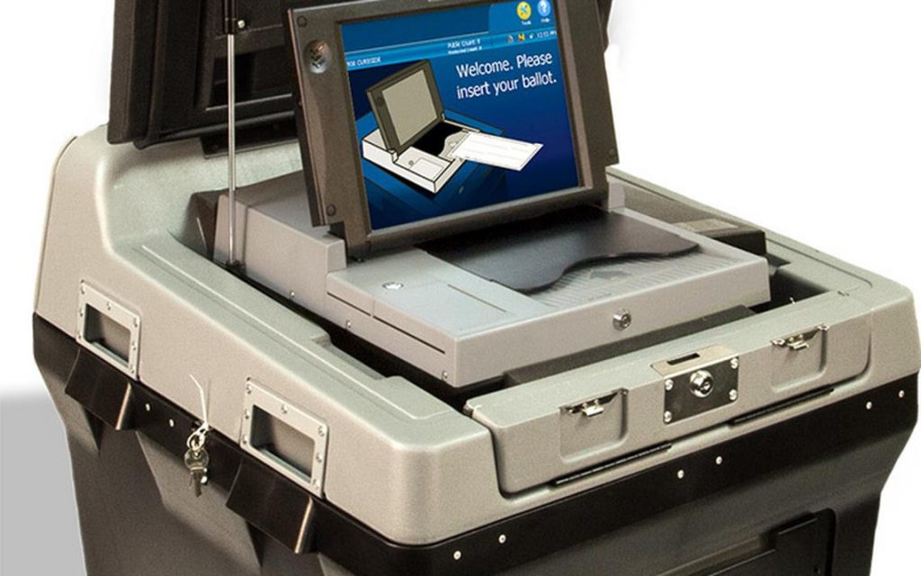 DS200 Gray scanner on top of black base has a blue touch screen that reads "Welcome, Please insert your ballot."