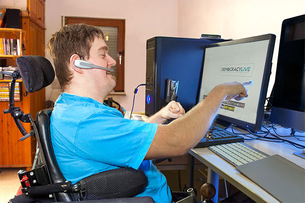 remote ballot marking system Individual in wheelchair uses remote ballot marking system on computer at a desk